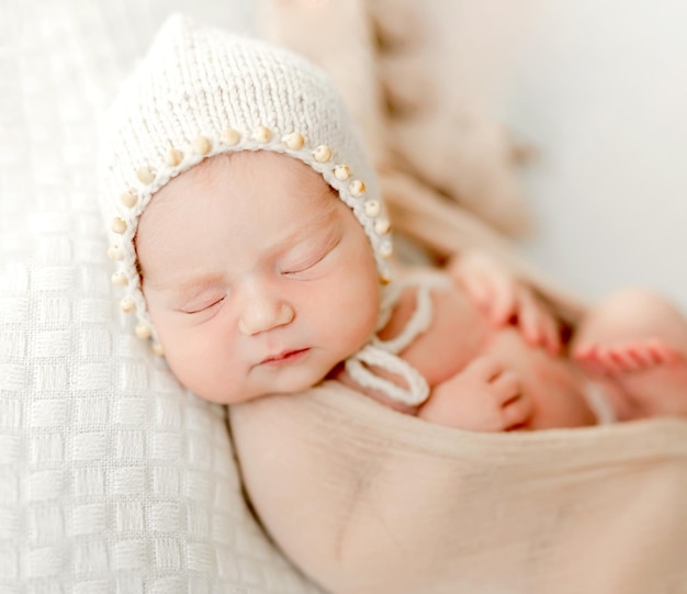 Cute newborn baby girl studio portrait