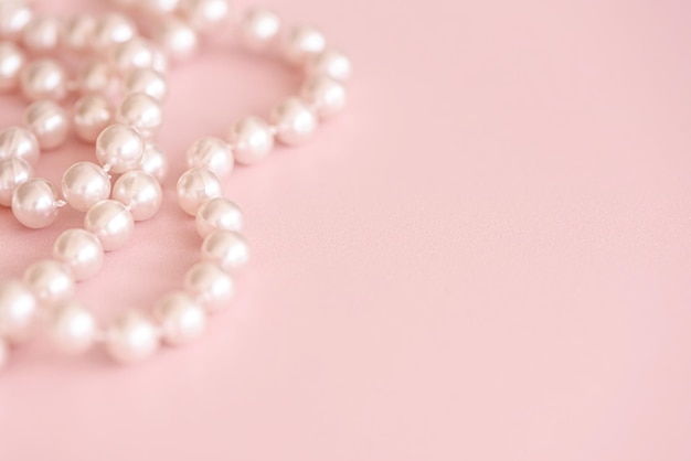 Cute pink background with pearls bead