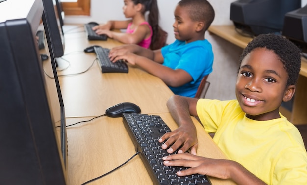 Cute pupils in computer class