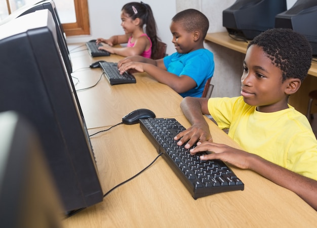 Cute pupils in computer class