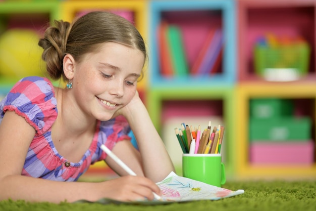 Cute schoolgirl doing homework