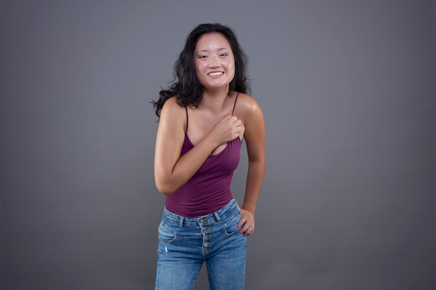 Cute smiling chinese woman isolated from the background