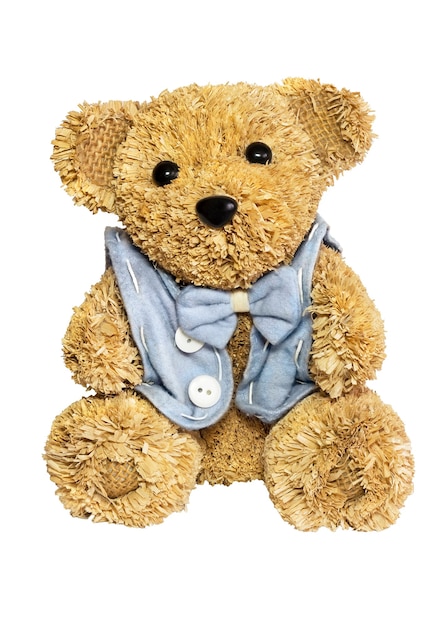 Cute straw Teddy bear toy in blue vest and butterfly tie isolated on white background.