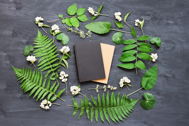 Cute and stylish branding mockup with wild flowers. Flat lay top view photo of a feminine layout.