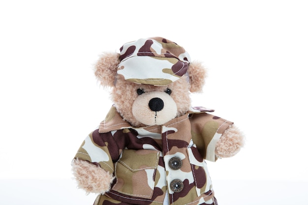 Cute teddy bear in soldier uniform isolated against white background