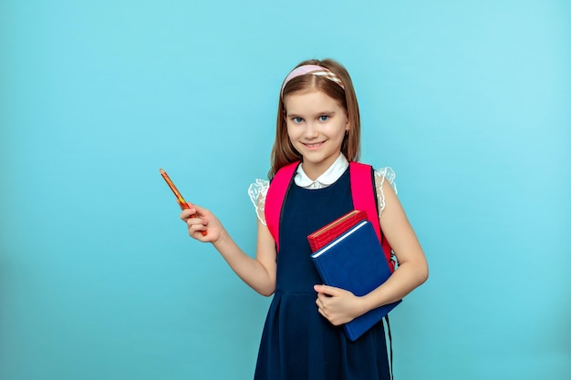 Cute teen girl with tablet pointing pencil isolated