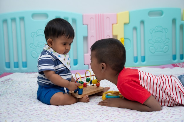 Cute two little boy play in room