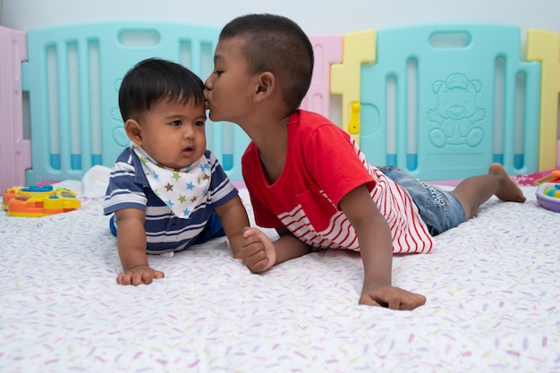 Cute two little boy play in room