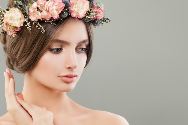 Cute woman with flowers summer spa portrait Beautiful face