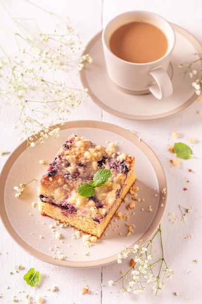 Cute yeast cake made of fruits and icing