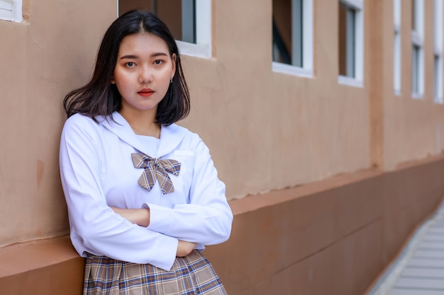 Cute and young girl wearing Japanese, Korean style schoolgirl uniform