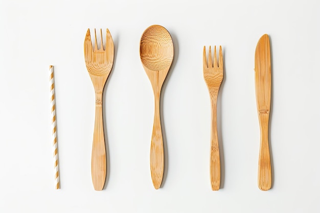 Photo cutlery of wood and plastic disposable spoon fork knife and straw isolated on white background