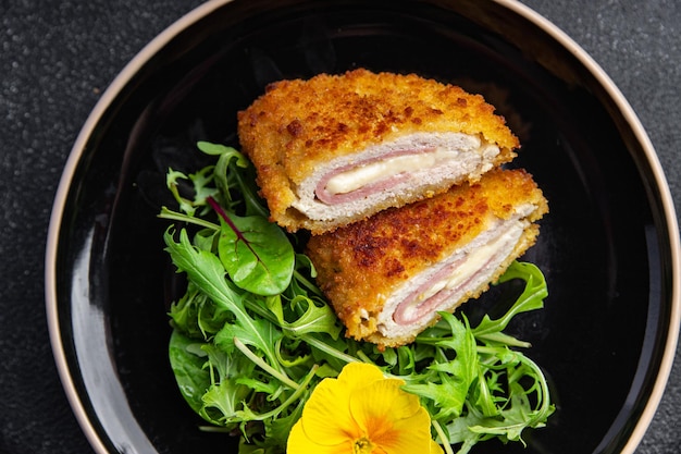 cutlet cordon bleu chicken meat, cheese, bacon healthy meal food snack on the table copy space