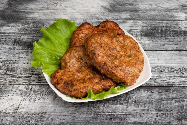 Cutlets homemade cutlets on a wooden white background