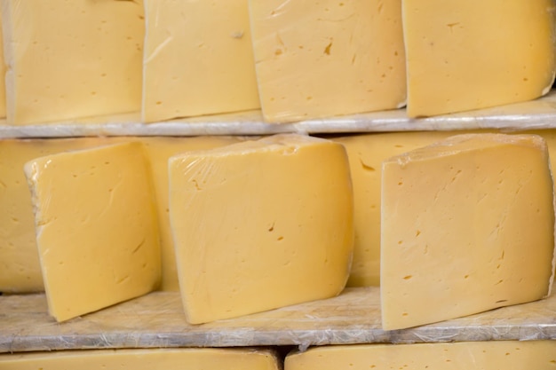 Cuts of kashkaval or kasseri cheese for sale