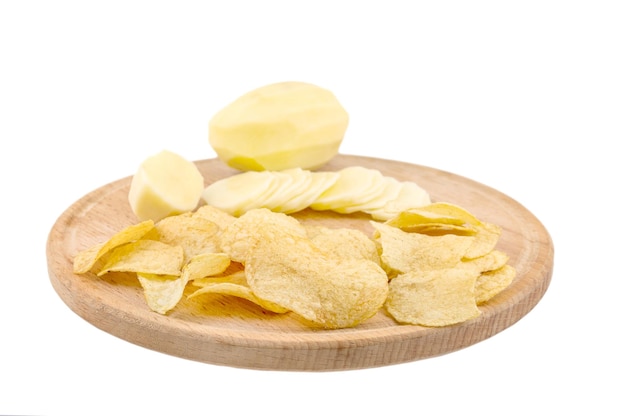 Cutting board with raw potato and potato chips isolated on white background