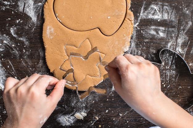 Cutting dough on different shapes. gingerbread. 