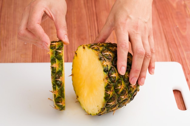 Cutting the fruit knife on a chopping board