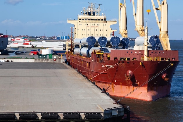 Cuxhaven Germany 11212022 Unloading parts of Vestas wind turbines in the seaport of Cuxhaven Germany from a cargo ship