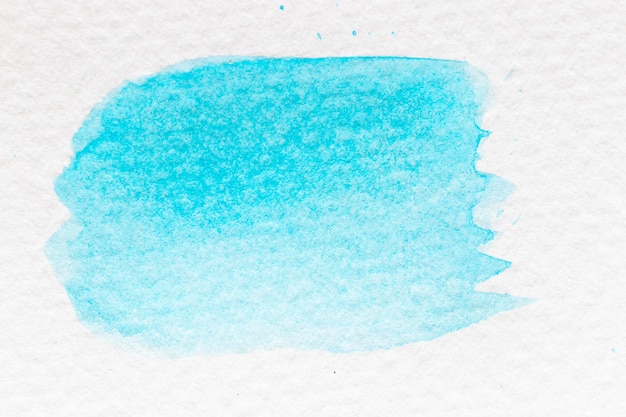 Cyan or light blue color watercolor handdrawing as brush or banner on white paper background 