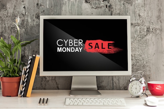 Cyber monday sale concept with desk and laptop