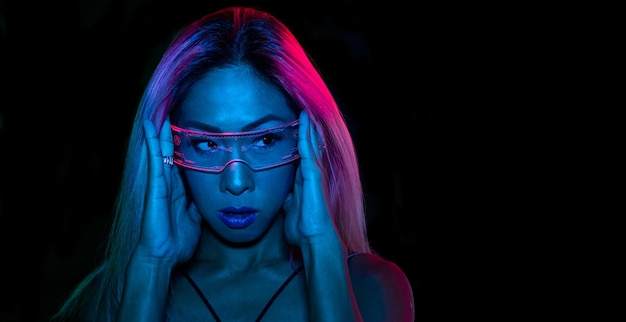 Cyber music. Night neon banner. Futuristic technology. Blue light Asian girl with futurisct glasses