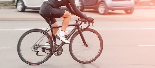 Cycling. The cyclist rides in the city at high speed. Participat