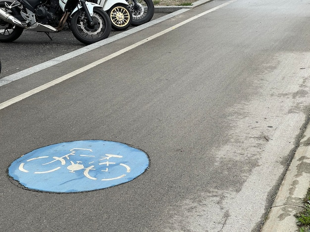 Cycling lane road sign painted on concrete copy space