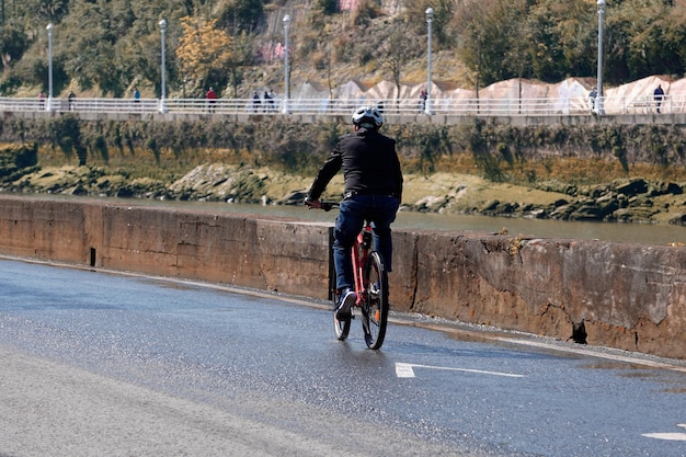 cyclist on the street, bicycle mode of transportation in the city