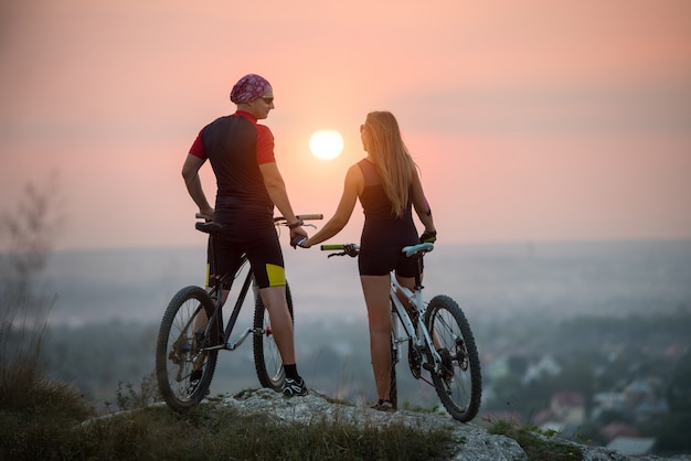 cyclist with mountain bikes