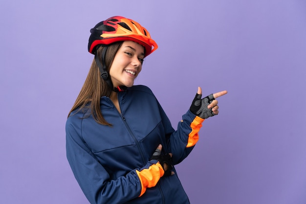 cyclist woman pointing finger to the side