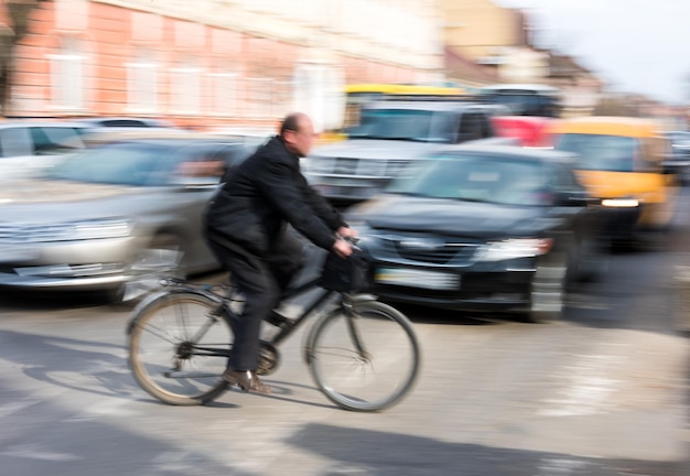 Cyclist on zebra crossing. Intentional motion blur