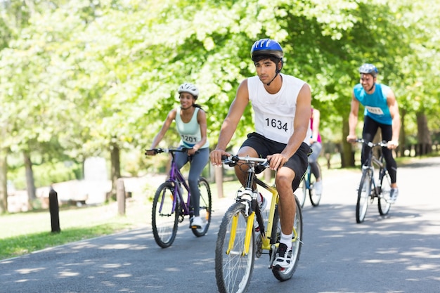 Cyclists riding bicycles on street