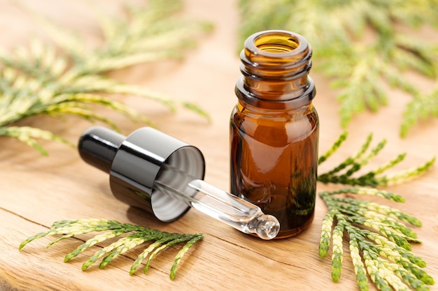 Cypress essential oil on still life Herbal remedies