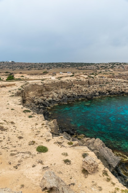 CYPRUS CAPE CAVO GRECO. Tourists arrived by car to the blue lagoon for swimming