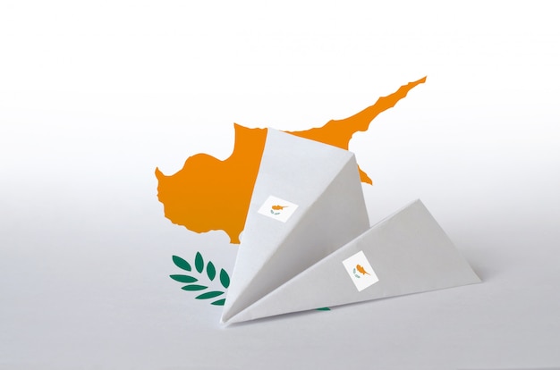 Cyprus flag depicted on paper origami airplane. Handmade arts concept