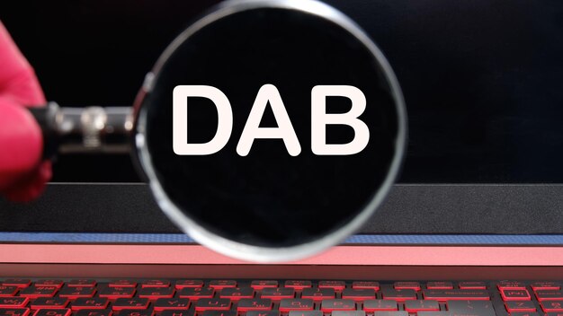 DAB text on the monitor found through a magnifying glass