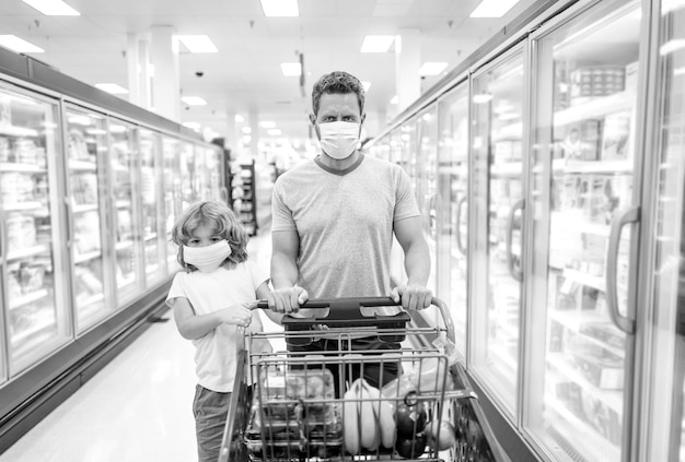 Dad and child at grocery store buying food at supermarket consumption