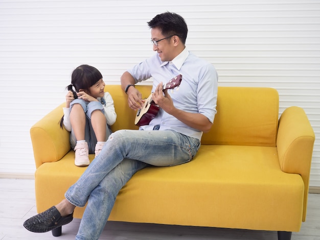 Dad is playing with his daughter in the house, family concept