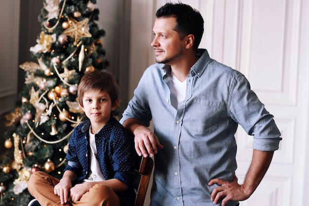 Dad and little baby have fun together at Christmas