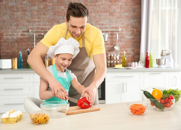 Dad and son cooking at home