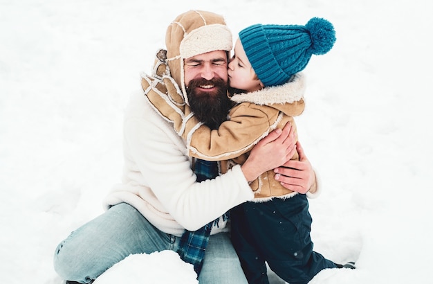 Daddy and boy enjoying nature wintertime