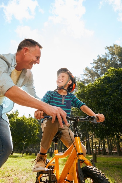 Dads got you Shot of a father teaching his son how to ride a bicycle