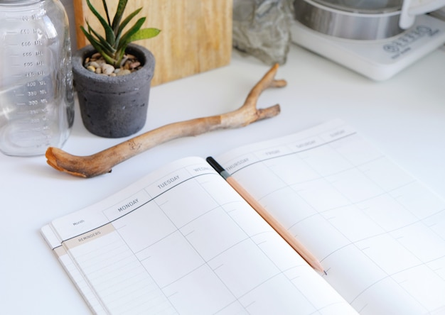 Photo daily diary. planner for a month. notepad in the interior of the kitchen.