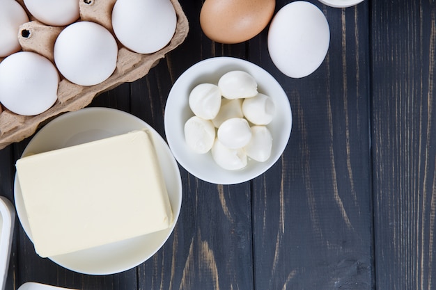 Dairy products on wooden table.