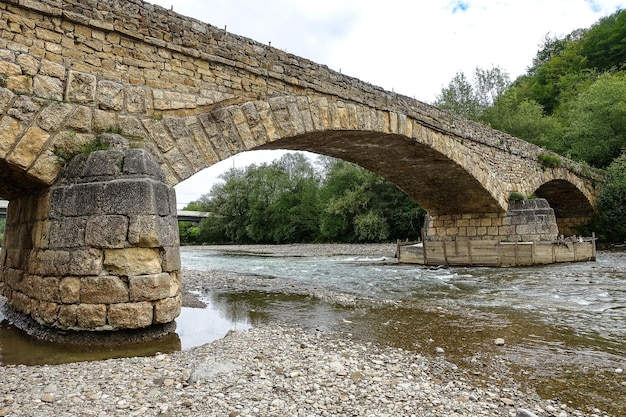 Dakhovsky picturesque stone bridge over the Dakh River Adygea Russia 2021