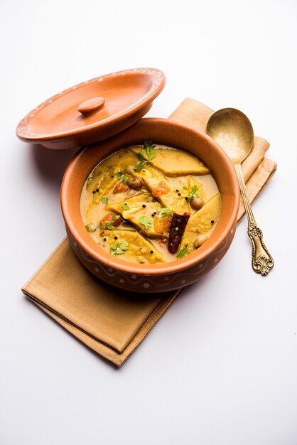 Dal Dhokli, Varan Phal or Chakolya is a gujarati, Rajasthani and maharashtrian dish made using diamond shape wheat flour cakes boiled in a dal. It's an easy one pot meal. served in a bowl.