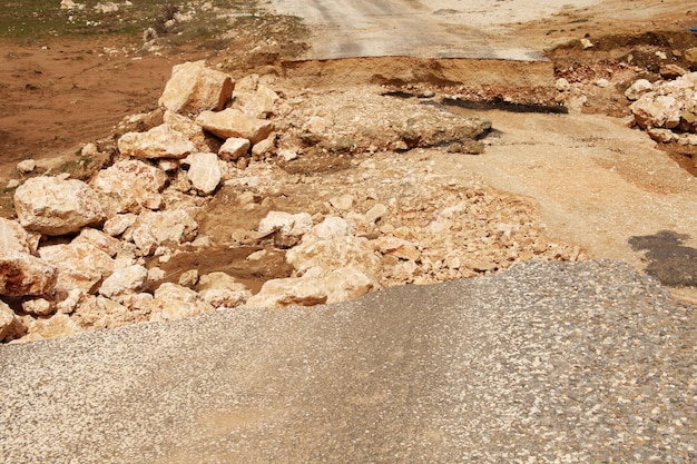 Damaged mountain asphalt road Country road