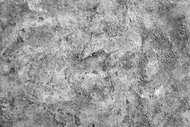 Damaged old concrete wall surface with rugged texture for background