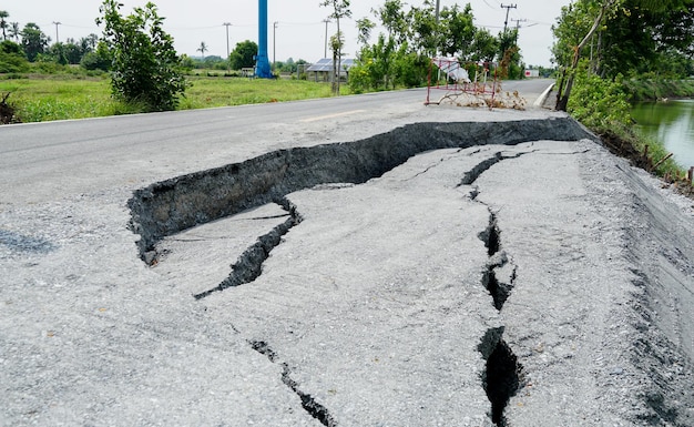 damaged road The road collapsed with a large crack the highway road was damaged the asphalt road